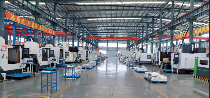 Factory workshop with rows of CNC machining equipment