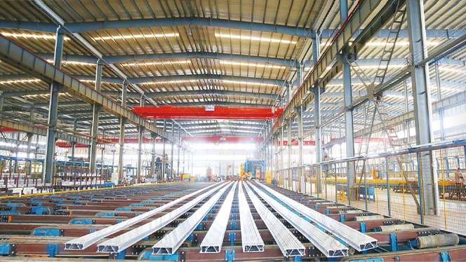 Aluminium profiles moving through an automated factory production line