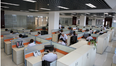 Technical and administration team working in the factory office